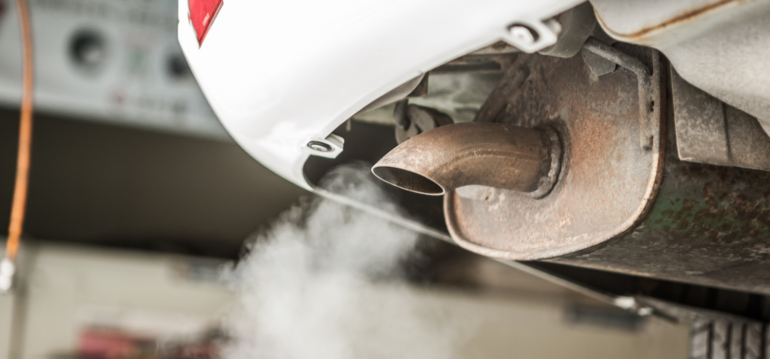 vehicle emissions leaving a car exhaust