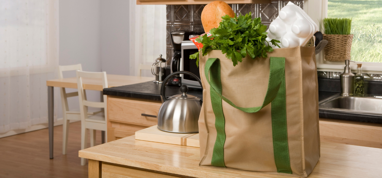 Reusable plastic-free grocery bag sitting on kitchen counter